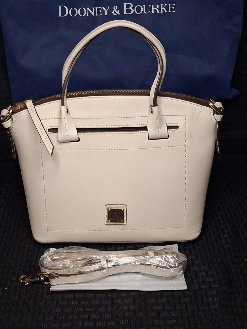 The Dooney & Bourke Beacon Domed Satchel Crossbody in a Creamy White Leather